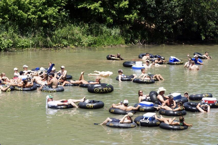 People tubing down the New Braunfels river in Texas.
